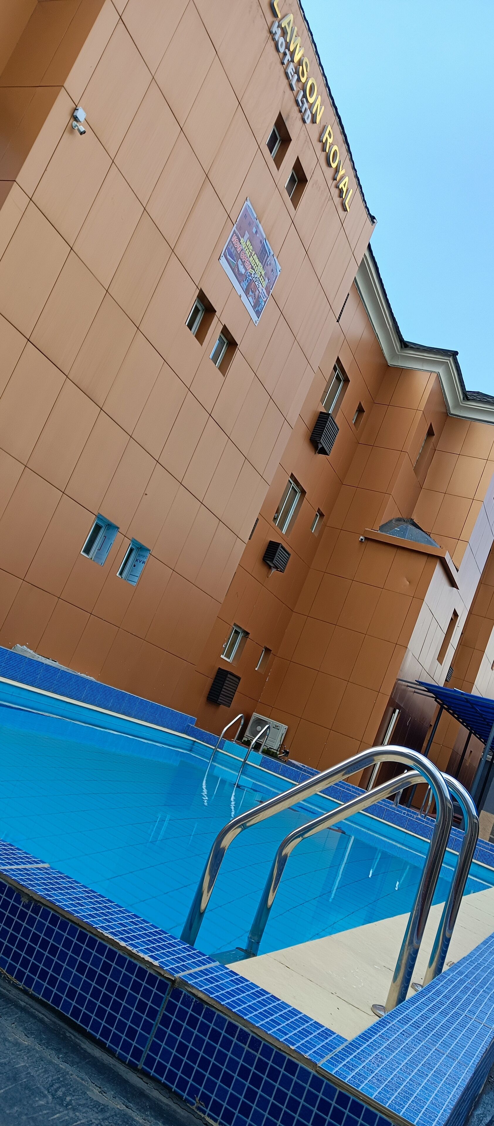 Outdoor pool, pool umbrellas, lifeguards on site