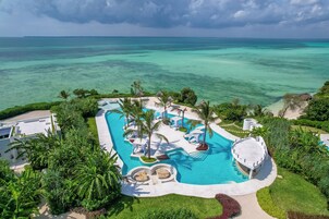 Outdoor pool, open 7:00 AM to 7:00 PM, free cabanas, pool umbrellas