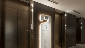 A modern elevator interior with a floor guide indicating levels 16 and 3, and a lobby reception. - Prince Smart Inn Osaka Yodoyabashi (Osaka)