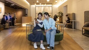 A modern interior with a reception desk, seating areas, and hanging pendant lights. - Prince Smart Inn Osaka Yodoyabashi (Osaka)