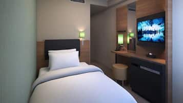 A hotel room with a bed, a TV, a desk with a mirror, and two wall-mounted lamps.