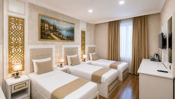 Deluxe Triple Room, 1 Bedroom, Desert view | Premium bedding, minibar, in-room safe, desk