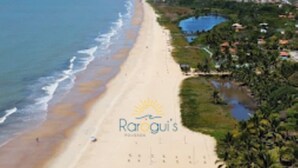 A beach with a logo for Rarogui's.
