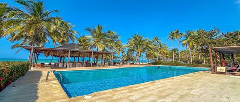 Outdoor pool, open 6:00 AM to 9:00 PM, pool loungers