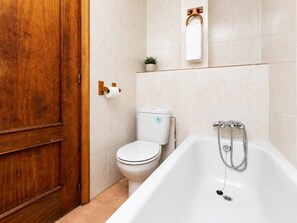 Bathtub, hair dryer, towels