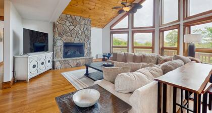Luxurious home with large deck, mountain views, air hockey, fireplace, & W/D