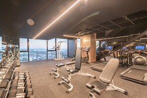 Work out with a city view at our gym, featuring a range of equipment and natural light.