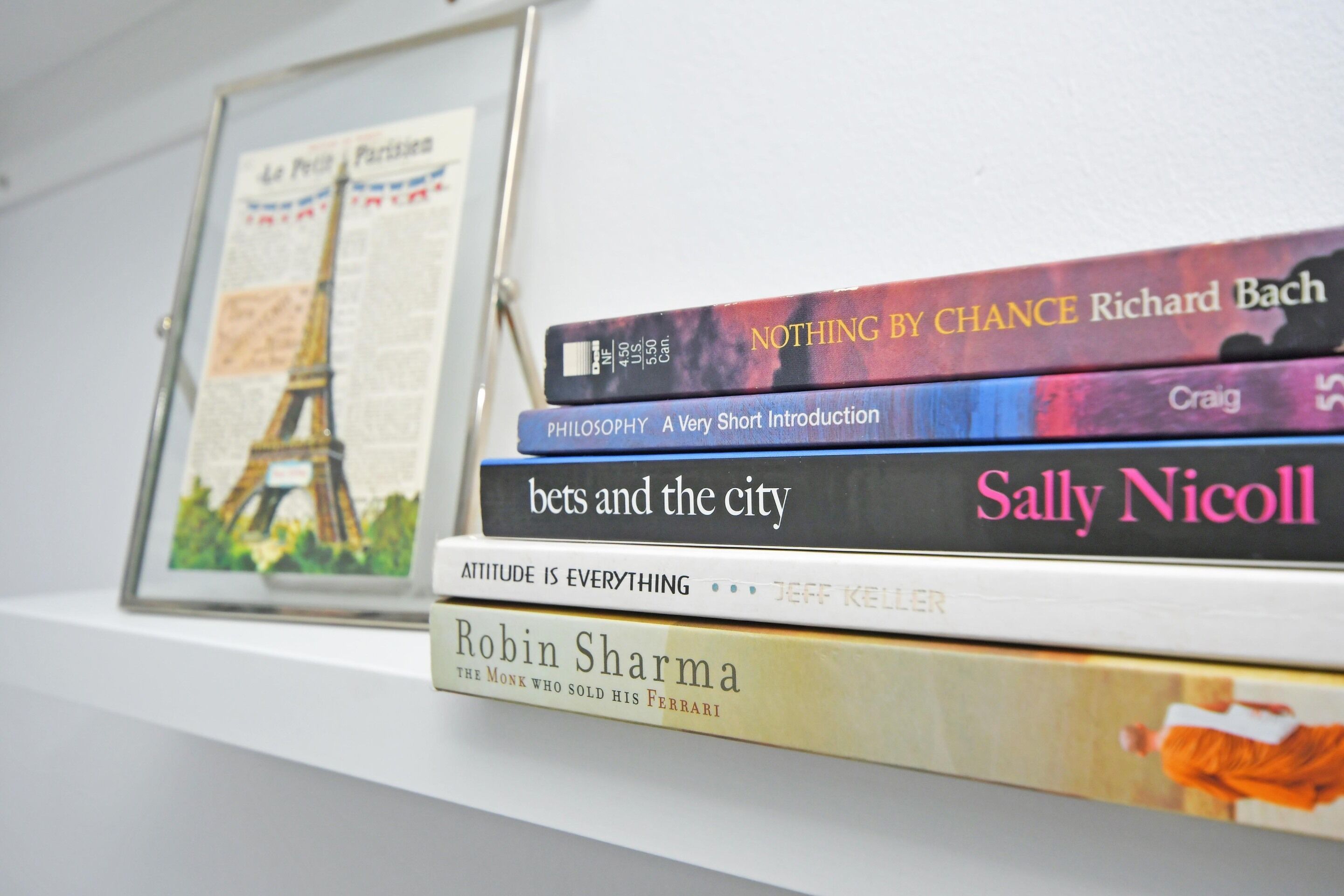 A stack of books on a shelf.