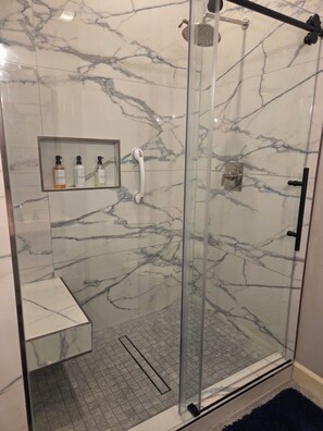 Bathtub, hair dryer, towels, soap