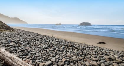 Secluded beachfront home with Pacific Ocean views, fireplace, game room, grill