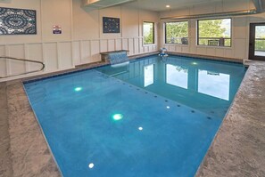 An indoor swimming pool with clear water, a diving board, and a no diving sign. - Best View in Smokies Modern Lux Pool Games Hot Tub (Sevierville)