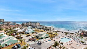 A resort with a pool, beach access, and multiple buildings. - ⛱️Gulf Views-Pools-Beach Bar-Skybridge2Beach-2BR Surfside Resort #707 (Miramar Beach)