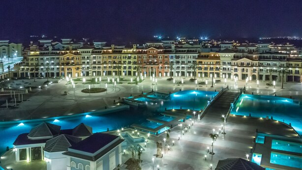 A resort with multiple swimming pools, a central courtyard, and a variety of building styles. - Porto Sharm Hotel Apartments (Sharm El Sheikh)