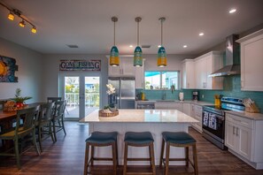 Enjoy cooking and dining in this well-equipped kitchen with a central island and dining area.