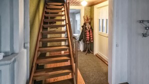 A wooden staircase leading to a room with a window and a door. - Beautiful home in Vena with WiFi (Vena)