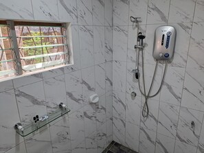 Shower, hair dryer, towels, soap