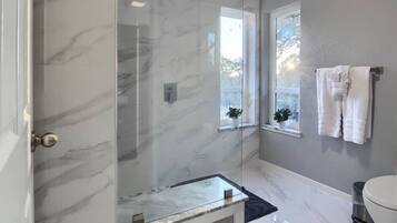 Shower, hair dryer, towels, soap