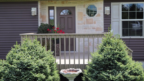 A house with a porch, stone accents, and a bird bath. - Drive It Home Recent New Construction, 5 minutes to Dreams Park or Cooperstown (Cooperstown)