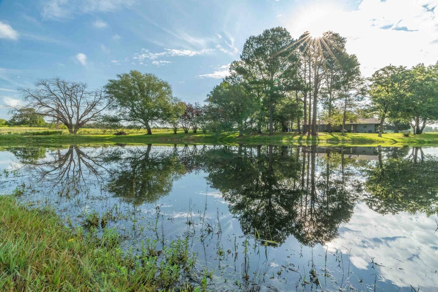 Farmhouse with pond at Canton Trade Days entrance