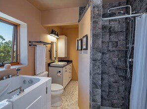 Jetted bath, hair dryer, towels, toilet paper