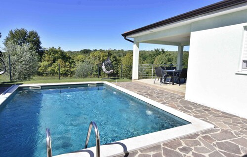 Holiday home with outdoor swimming pool