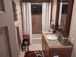 Combined shower/bathtub, hair dryer, towels, soap