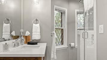 Combined shower/tub, hair dryer, towels, soap