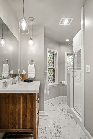 Combined shower/tub, hair dryer, towels, soap