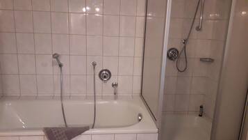 Bathtub, hair dryer, towels