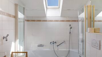 Bathtub, hair dryer, towels