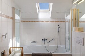 Bathtub, hair dryer, towels