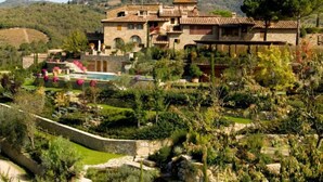 A large, multi-story stone building with a terracotta roof, surrounded by lush gardens and a swimming pool. - Lamore di Carla by Interhome (Greve in Chianti)