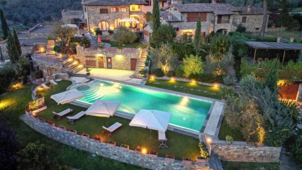 A large stone building with a swimming pool, outdoor seating, and a well-maintained garden. - Lamore di Carla by Interhome (Greve in Chianti)