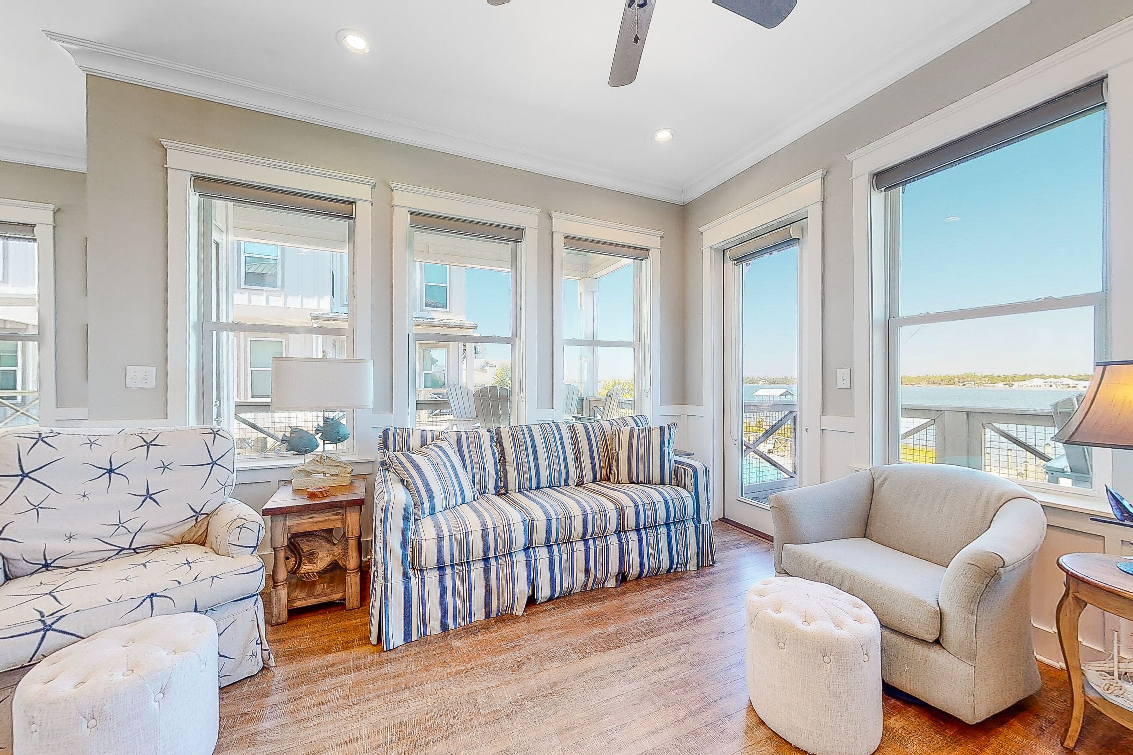 Modern waterfront cottage steps to beach with on-site pool, pier & docks