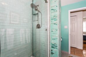 Shower, hair dryer, towels, shampoo