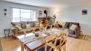 A cozy living room with a wooden dining table, two sofas, and a fireplace. - Cozy Telluride Condo Near Ski Resort & Hiking (Telluride)
