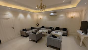 Luxury Bungalow | Living area | 43-inch Smart TV with digital channels, TV, fireplace