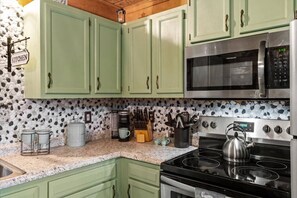 Fridge, microwave, stovetop, coffee/tea maker