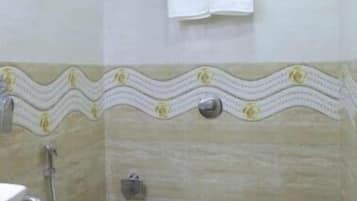 Shower, rainfall showerhead, towels, soap
