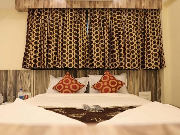 Habitación Deluxe | Camas extra, wifi gratis y ropa de cama 