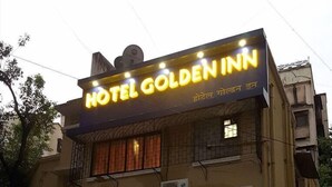 A building with a sign that reads "HOTEL GOLDEN INN" in English and another language. - Hotel Golden Inn (Mumbai)