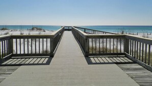 A wooden boardwalk leading to a beach with clear skies. - Luxe Gulf Front Condo, Stunning Views. Community Pool (Santa Rosa Beach)