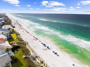 A coastal hotel with a beach view, a pool area, and a boardwalk leading to the beach. - Gulf View Home | Steps to Beach Access (Santa Rosa Beach)
