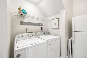 A laundry room with two white Whirlpool washers and a refrigerator. - Gulf View Home | Steps to Beach Access (Santa Rosa Beach)