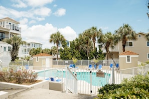 A private pool area with a white fence, blue lounge chairs, and a sign indicating no trespassing. - Gulf View Home | Steps to Beach Access (Santa Rosa Beach)