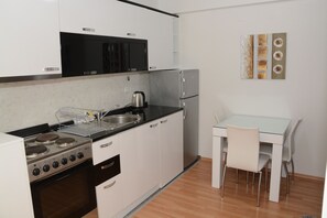 Fridge, oven, electric kettle, cookware/dishes/utensils