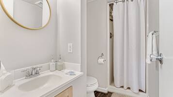 Shower, towels, soap, toilet paper