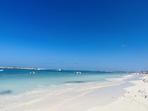 On the beach, sun-loungers, beach towels
