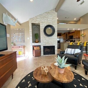 Smart TV, fireplace, books, offices