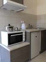 Chambre Double Deluxe | Cuisine privée | Mini réfrigérateur, batterie de cuisine, vaisselle et ustensiles